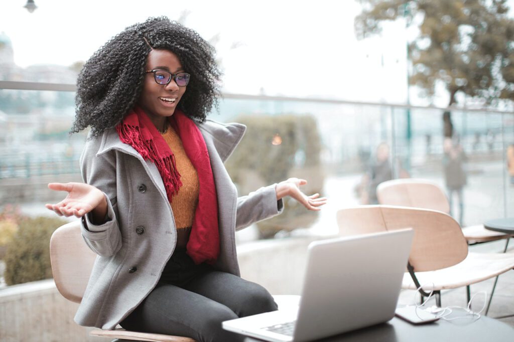 Woman wearing glasses looking at a computer